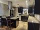 Modern kitchen with dark cabinetry, granite countertops, and stainless steel appliances at 1629 E Garfield St, Phoenix, AZ 85006