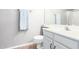 Clean bathroom with a toilet, sink, vanity and towel rack with a light blue towel hanging from it at 1633 E Lakeside Dr # 48, Gilbert, AZ 85234