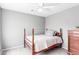 Bedroom with a traditional four-poster bed and a neutral color scheme at 1633 E Lakeside Dr # 48, Gilbert, AZ 85234