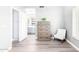 Bedroom with hard surface flooring, door leading to the en suite bathroom, with natural light at 1633 E Lakeside Dr # 48, Gilbert, AZ 85234