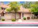Charming home featuring desert landscaping, including beautiful trees and shrubs at 1633 E Lakeside Dr # 48, Gilbert, AZ 85234