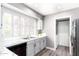 Bright and modern kitchen with white cabinets, updated appliances, and plenty of natural light at 1633 E Lakeside Dr # 48, Gilbert, AZ 85234