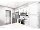 Updated kitchen with stainless steel appliances, white cabinetry, and ample counter space at 1633 E Lakeside Dr # 48, Gilbert, AZ 85234