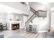 Spacious living area featuring a fireplace and staircase access to the upper level at 1633 E Lakeside Dr # 48, Gilbert, AZ 85234
