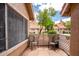 Outdoor patio with privacy and two chairs at 1633 E Lakeside Dr # 48, Gilbert, AZ 85234