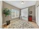 Cozy bedroom with a murphy bed, natural light, and modern flooring at 16427 W Labyrinth Ln, Surprise, AZ 85374