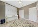 Spare bedroom showcasing a Murphy bed and built-in shelving for storage at 16427 W Labyrinth Ln, Surprise, AZ 85374