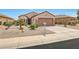 Charming single-story home with desert landscaping and a two-car garage at 16427 W Labyrinth Ln, Surprise, AZ 85374
