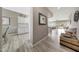 Bright hallway with modern flooring and a view into the living space at 16427 W Labyrinth Ln, Surprise, AZ 85374