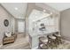 Open kitchen design with granite countertops, a breakfast bar, and stylish pendant lighting at 16427 W Labyrinth Ln, Surprise, AZ 85374