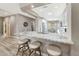 Open-concept kitchen with granite countertops and bar seating at 16427 W Labyrinth Ln, Surprise, AZ 85374