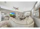 Bright and open living room with a ceiling fan and comfortable seating at 16427 W Labyrinth Ln, Surprise, AZ 85374