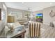 Spacious living room with ample seating, natural light, and modern décor at 16427 W Labyrinth Ln, Surprise, AZ 85374