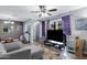 A bright living room featuring hardwood floors, contemporary decor, and ample natural light at 1645 W Baseline Rd # 2125, Mesa, AZ 85202