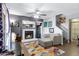 Cozy living room with a fireplace, modern furnishings, and a ceiling fan at 1645 W Baseline Rd # 2125, Mesa, AZ 85202