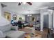 Cozy living room featuring a ceiling fan, a gray sofa, and wood flooring at 1645 W Baseline Rd # 2125, Mesa, AZ 85202