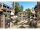 Charming community pond with a gazebo and fountain, surrounded by lush landscaping and residential buildings at 1645 W Baseline Rd # 2125, Mesa, AZ 85202