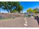 Spacious backyard with a patio seating area and rock landscaping at 16820 N 152Nd Ln, Surprise, AZ 85374