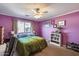 Bright bedroom with a window, comfortable carpet, natural lighting, and colorful accents at 16820 N 152Nd Ln, Surprise, AZ 85374