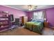 Cozy bedroom with a desk, wood dresser, neutral carpet, and natural light from the window at 16820 N 152Nd Ln, Surprise, AZ 85374