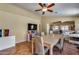 Inviting dining room with tile flooring, modern light fixture, and adjacent living spaces at 16820 N 152Nd Ln, Surprise, AZ 85374