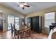 Bright dining room with vaulted ceilings, sliding glass doors, and neutral paint colors at 16820 N 152Nd Ln, Surprise, AZ 85374