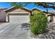 Charming home featuring a two-car garage, well-maintained landscaping, and a neutral color palette at 16820 N 152Nd Ln, Surprise, AZ 85374