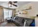Inviting living room featuring a comfortable gray couch, natural light, and a cozy atmosphere at 16820 N 152Nd Ln, Surprise, AZ 85374