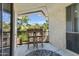 Cozy outdoor balcony with dining set, offering views of the palm trees at 1701 E Colter St # 488, Phoenix, AZ 85016
