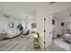 Bright living room adjacent to a bedroom with stylish decor and modern lighting fixtures at 1701 E Colter St # 488, Phoenix, AZ 85016
