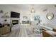Bright living room with a fireplace, open floor plan, and modern decor at 1701 E Colter St # 488, Phoenix, AZ 85016
