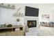 Living room with a fireplace, mantel display shelves, and decorative furniture at 1701 E Colter St # 488, Phoenix, AZ 85016