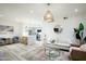 Bright open floor plan with a modern living room and a kitchen with a kitchen island at 1701 E Colter St # 488, Phoenix, AZ 85016