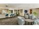 Lounge area with comfortable chairs, bar area, and a television at 1701 E Colter St # 488, Phoenix, AZ 85016