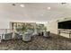 Open lounge area with stylish seating, views of exterior, and television at 1701 E Colter St # 488, Phoenix, AZ 85016