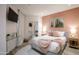 Cozy bedroom featuring bright walls, bedside tables, and a mirror to expand the space at 1701 E Colter St # 488, Phoenix, AZ 85016