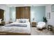Spacious bedroom featuring a sitting area, pendant lights, and serene decor at 1701 E Colter St # 488, Phoenix, AZ 85016