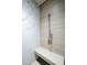 Bright marble shower featuring a built-in bench and a handheld shower fixture at 1701 E Colter St # 488, Phoenix, AZ 85016