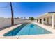 Beautiful pool area with a white patio cover, offering an ideal space for relaxation and enjoyment at 1920 N Cavalier Dr, Tempe, AZ 85288