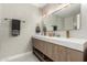 Bathroom showcasing a double vanity with modern hardware, and unique wall decor at 1920 N Cavalier Dr, Tempe, AZ 85288