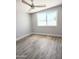 Bright bedroom with wood-look flooring and modern ceiling fan at 1920 N Cavalier Dr, Tempe, AZ 85288