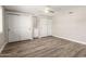 A bright bedroom featuring dual closets and a ceiling fan at 1920 N Cavalier Dr, Tempe, AZ 85288