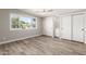 A bright bedroom featuring a window with a neighborhood view and dual closets at 1920 N Cavalier Dr, Tempe, AZ 85288