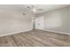 Neutral bedroom with wood-look floors, a ceiling fan, and a double door closet at 1920 N Cavalier Dr, Tempe, AZ 85288