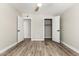 Bedroom features wood-look floors, a ceiling fan, closet, and easy access to a second closet at 1920 N Cavalier Dr, Tempe, AZ 85288