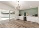 Dining area with modern cabinetry, sleek countertops, wine cooler and sliding glass door at 1920 N Cavalier Dr, Tempe, AZ 85288