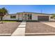Beautiful single-story home featuring a modern design, gray accents, and a landscaped front yard at 1920 N Cavalier Dr, Tempe, AZ 85288