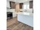 Modern kitchen features stainless steel appliances, quartz countertops, and an island at 1920 N Cavalier Dr, Tempe, AZ 85288