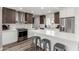 Bright kitchen showcasing an island with seating, stainless steel appliances, and modern wood and white cabinets at 1920 N Cavalier Dr, Tempe, AZ 85288