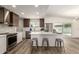 Modern kitchen with stainless steel appliances, white countertops, and sleek cabinetry at 1920 N Cavalier Dr, Tempe, AZ 85288